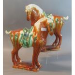 Stylish handed pair of Chinese Tang style pottery horses with Sancai glazes, on rectangular bases.