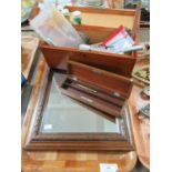 A patinated artist's brush box with materials and a small carved wooden framed mirror together