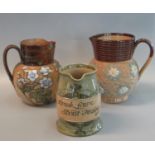 Two Doulton Lambeth stoneware single handled jugs, one decorated with raised flower heads, the other