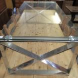 Modern contemporary, glass top coffee table on X-frame chrome supports. (B.P. 21% + VAT)