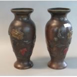 Pair of Japanese bronze baluster shaped vases, relief decorated with chrysanthemums, foliage and