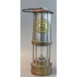 E Thomas and Williams Ltd. of Aberdare brass miners' safety lamp in unused condition. 25 cm high
