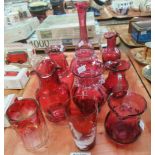 Tray of 19th and 20th century cranberry glass, to include: jugs with clear glass handles, vase