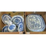 Two boxes of blue and white china to include: Seven large oval Staffordshire 'willow pattern' meat