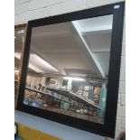 A modern, black finish framed wall mirror of square form 125x125cm approx. (B.P. 21% + VAT)