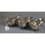 Pair of silver sauce boats on hoof feet, Birmingham hallmarks, together with another silver sauce