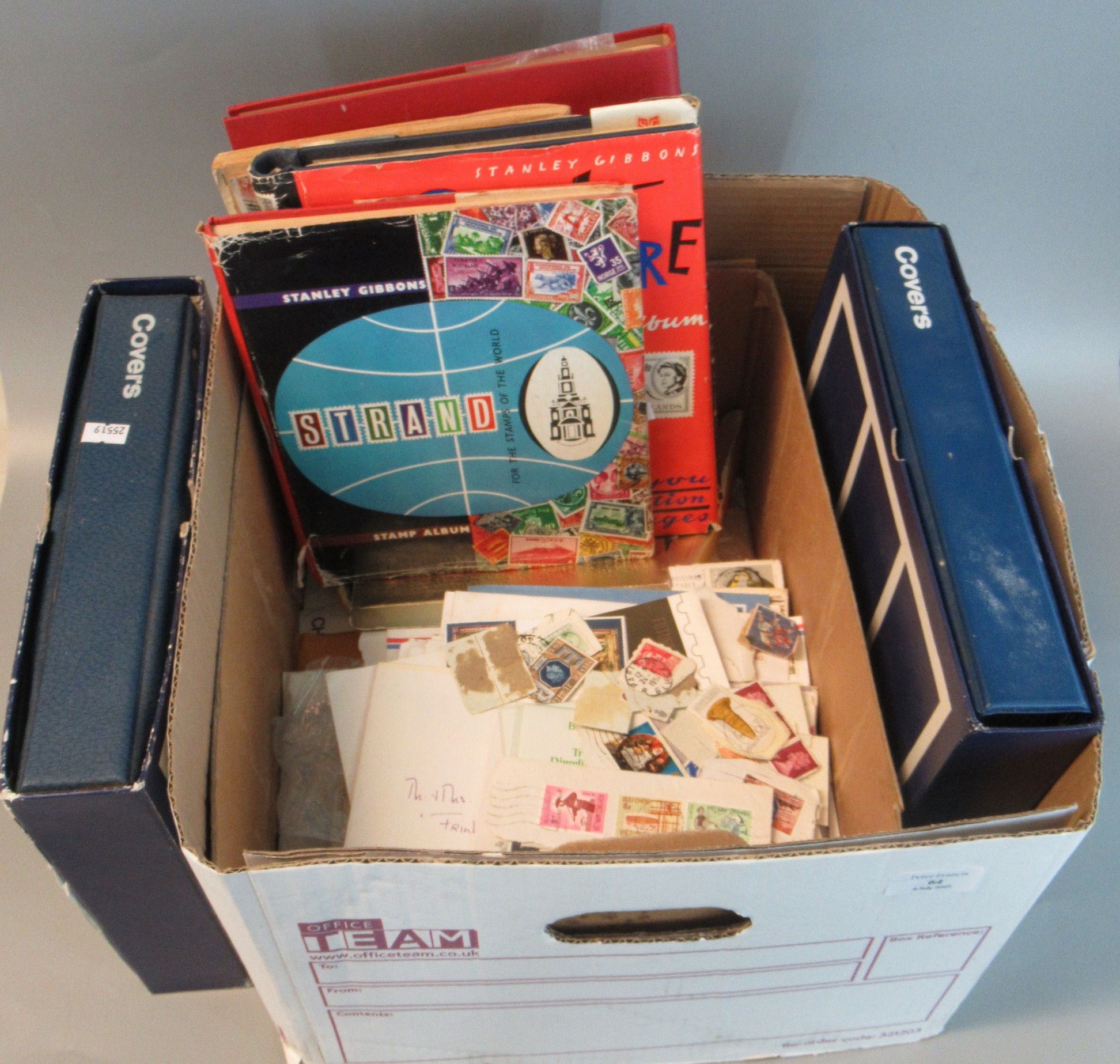 Box with all world selection of stamps in five albums, envelopes and packets plus two albums of