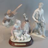 A collection of Lladro and other porcelain figurines and figure groups, to include 2 birds on