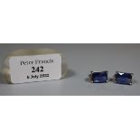 Pair of white metal framed, rectangular blue stone set stud earrings. (B.P. 21% + VAT)