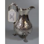 Victorian silver helmet shaped cream jug on shell design feet. Edinburgh 1868 5.2 troy ozs