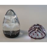 Caithness art glass paperweight 'Cascade' together with another cranberry and clear glass faceted