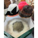 A collection of good quality vintage and designer hats in hat boxes, to include: a pheasant