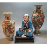2 similar Japanese Satsuma vases together with a study of a seated oriental man with pipe on