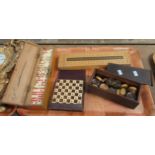 Tray of vintage games to include: wooden box of dominoes, draughts pieces, cribbage board and
