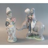 A Lladro Spanish figure group 5352 'Hindu Children' together with a Lladro porcelain figurine of a