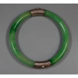 Silver mounted jade hinged bangle. (B.P. 21% + VAT)