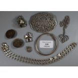 A collection of silver and white metal jewellery including a silver bangle, silver flattened curb