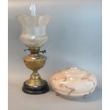 Early 20th century double oil burner lamp with frosted and etched shade and brass reservoir,