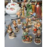 Tray of West Germany Goebel figurines of children to include, German boys in traditional dress,