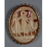Large yellow metal carved portrait cameo brooch, 'The Three Graces'. Associated case. (B.P. 21% +