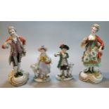 Collection of continental porcelain hand-painted figurines, to include young boy and girl with dog