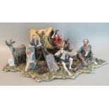 A large Capodimonte figure group of a gypsy caravan with figures cooking and playing musical