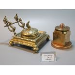 A Brass Gothic design single desk inkwell with grotesque and dolphin mounts, together with another