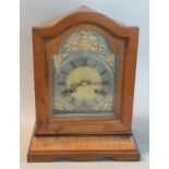 Early 20th century mahogany two train mantle clock with silver chapter ring and roman numerals. (B.