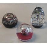Three Caithness glass paperweights to include 'Alien', 'Space Beacon' and another in original