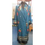 A Chinese Kimono overall decorated and embroidered with flowers, foliage and butterflies to the