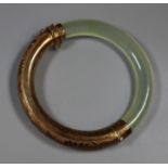 Engraved silver and hard stone hinged bangle. (B.P. 21% + VAT)