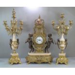 Modern Louis XV style French gilt metal clock garniture, the clock of lyre shape with foliate mounts