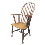 19th century oak and elm spindle back Windsor armchair standing on turned supports. (B.P. 21% + VAT)