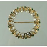 A circle brooch set with emerald, pearls and diamonds. Approx weight 6.6 grams. (B.P. 21% + VAT)