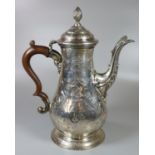 George III silver coffee pot having chased floral and foliate decoration overall with turned