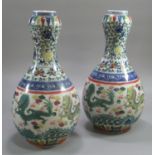 Pair of Chinese porcelain baluster shaped vases with inverted garlick bulb necks, overall