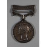 Queen Victoria Indian Mutiny medal 1858 with clasp for Lucknow, awarded to P Clarke 1st Battalion