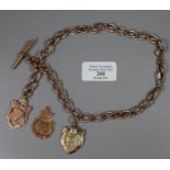 A Victorian rose gold double Albert chain with three 9ct gold fobs. Length 16 inches. Approx