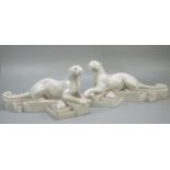 After P. Trudeau, a pair of Art Deco style recumbent white panthers on geometric bases. Signed. (