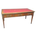French design walnut writing desk, the leather inset top with brass mouldings above three drawers
