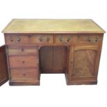 Victorian mahogany knee hole desk, the leather inset and moulded top above two drawers with brass