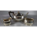 George VI Three piece silver tea service, to include: Teapot with ebonised handle, two handled