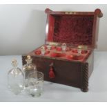 Regency design mahogany decanter box, having spiral columns and brass recessed carrying handles, the