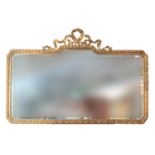 Modern gilt framed mirror of rectangular form having ribbon mount. 139x92cm approx. (B.P. 21% + VAT)