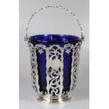 Victorian silver and pierced basket with swing handle and Bristol Blue glass liner by George John