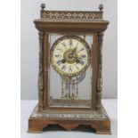 Late 19th century French Champleve enameled four glass mantle clock with overall foliate decoration,