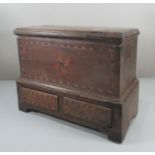 Early 19th century Welsh oak miniature Coffwr Bach, the moulded hinged lid above herringbone