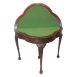 19th century mahogany folding card table, the shaped and beaded top above a plain frieze standing on