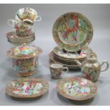 A Chinese porcelain Canton tea service overall decorated in famille rose designs with designs of