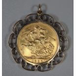 1927 gold full sovereign in 9ct gold mount. (B.P. 21% + VAT)